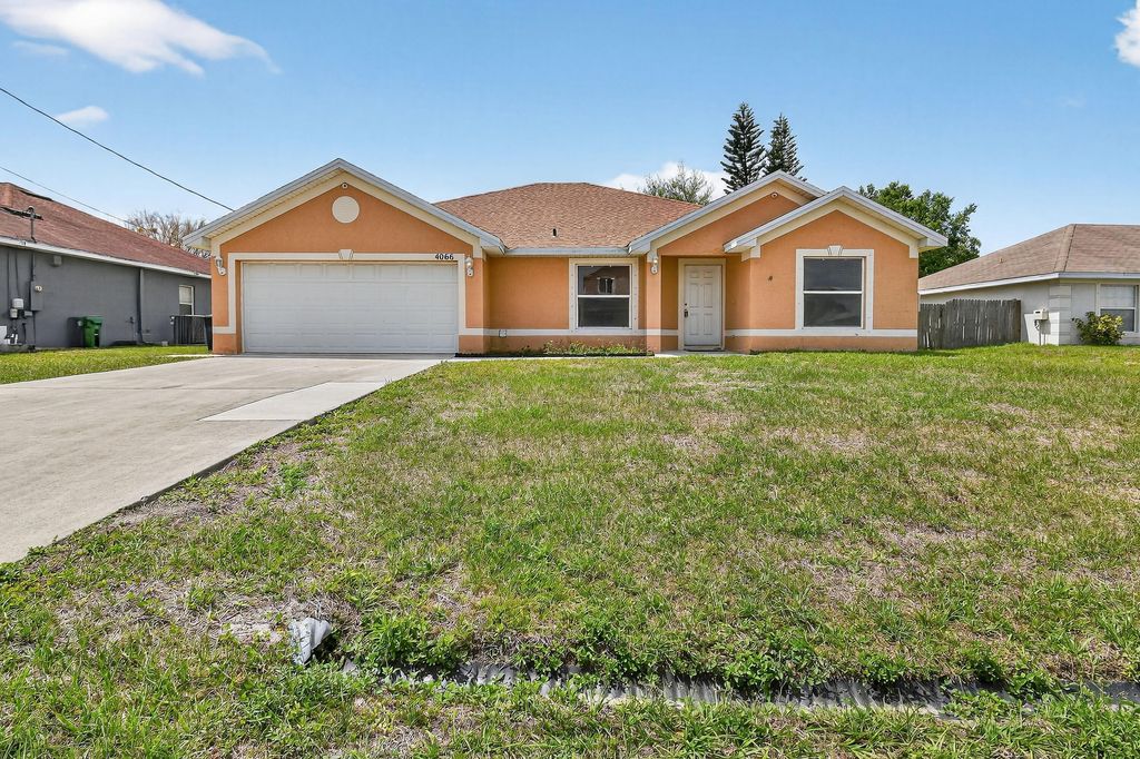 Photo of 4066 SW Canrady Street, Port Saint Lucie, FL 34953 (MLS # B26010595)