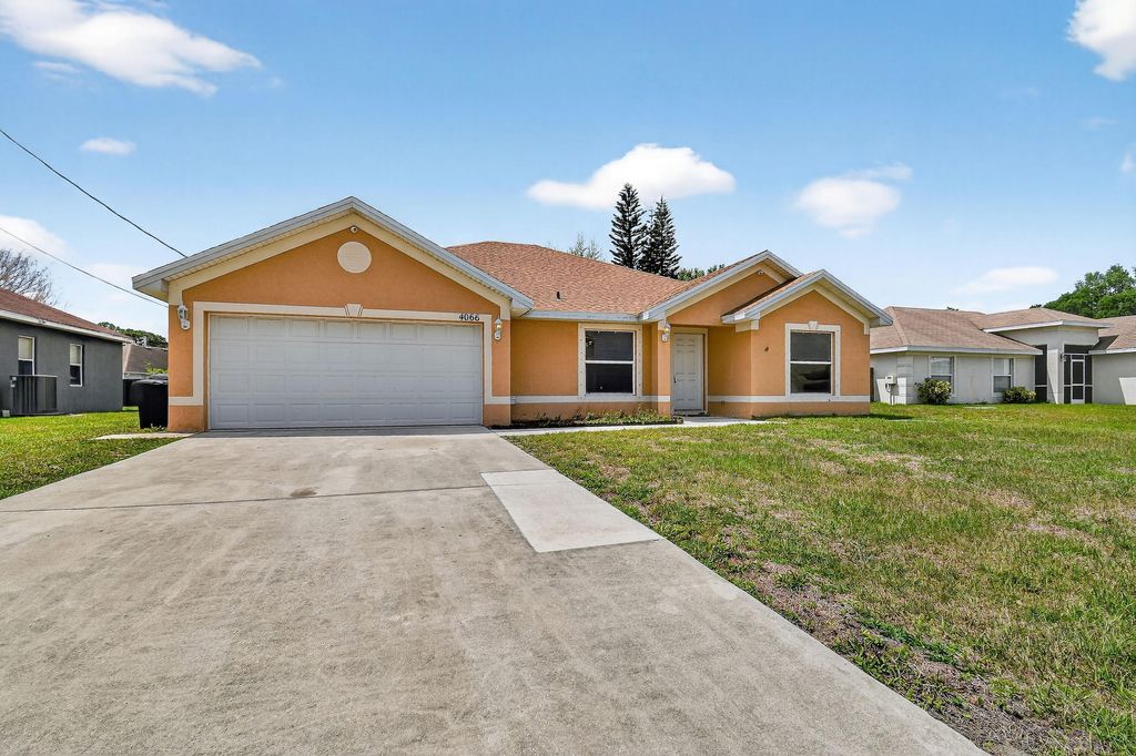 Photo of 4066 SW Canrady Street, Port Saint Lucie, FL 34953 (MLS # B26010595)