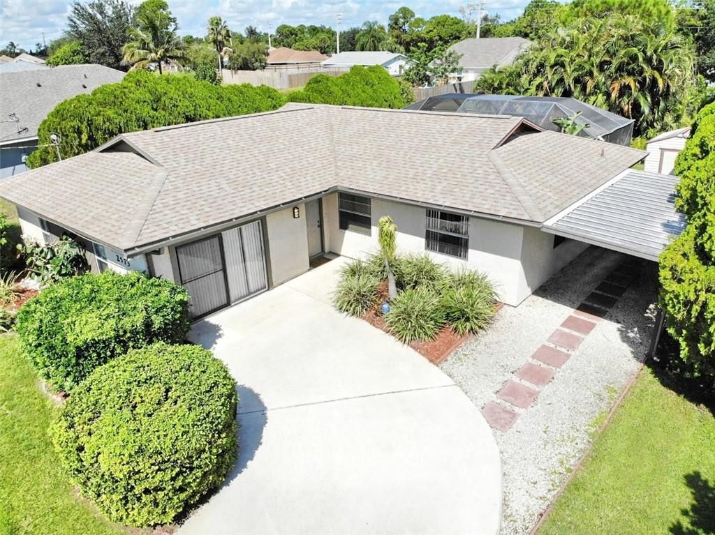 Photo of 2573 SW Cooper Ln, Port Saint Lucie, FL 34984 (MLS # F10305342)