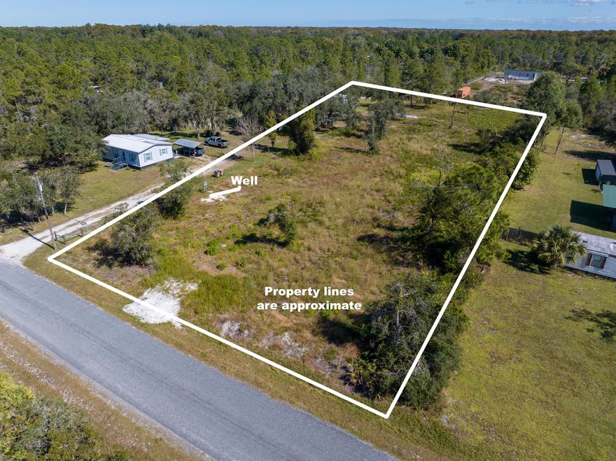 Over a 1.25 Acre in Beautiful Okeechobee - Ready for Your Vision! Discover the perfect opportunity to own over an acre of land in the peaceful, scenic surroundings of Okeechobee, FL. This versatile property is 90% groomed, fenced on three sides, and already equipped with key improvements saving you time, money, and effort as you build your ideal Florida getaway. Featuring a permitted 100-amp electrical service and a brand-new permitted well, the essentials are in place and ready for your next step. Whether you're dreaming of a mobile home, RV setup, barndominium, or simply a recreational retreat, this property welcomes it all. Conveniently located just 1,000 ft from the Turnpike Yeehaw Junction exit, you'll enjoy easy access to everywhere you want to be