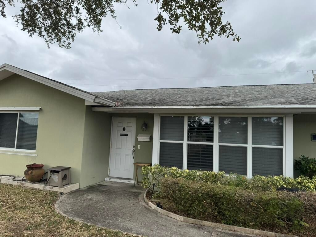 Photo of 586 N Redwood Drive, Lake Park, FL 33403 (MLS # B26027402)