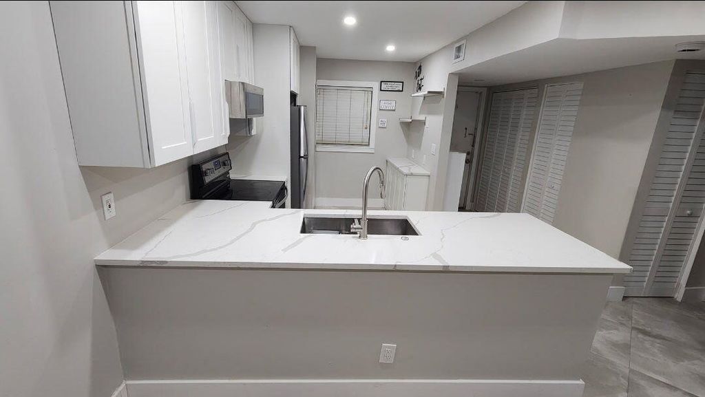 Photo of 8605 W Sample Road #311, Coral Springs, FL 33065 (MLS # B26005903)