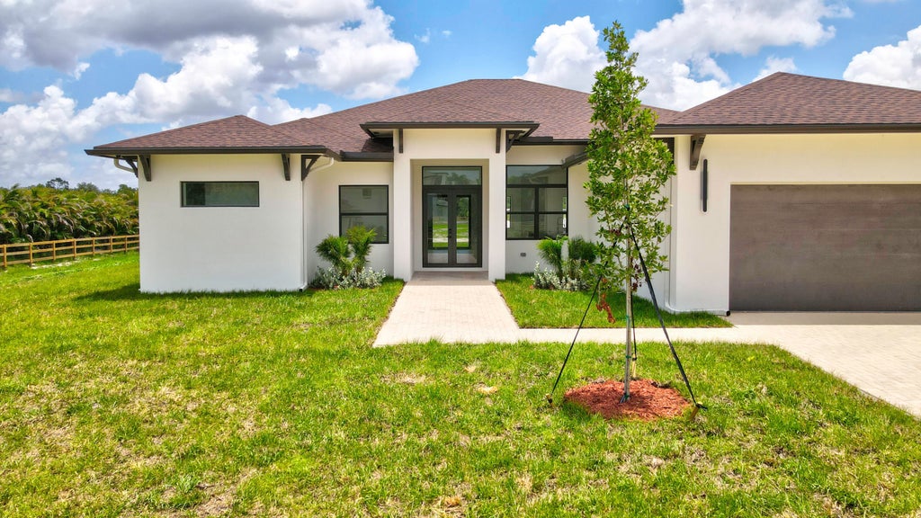 Photo of 2324 DEER RUN Trail, The Acreage, FL (MLS # B26052327)