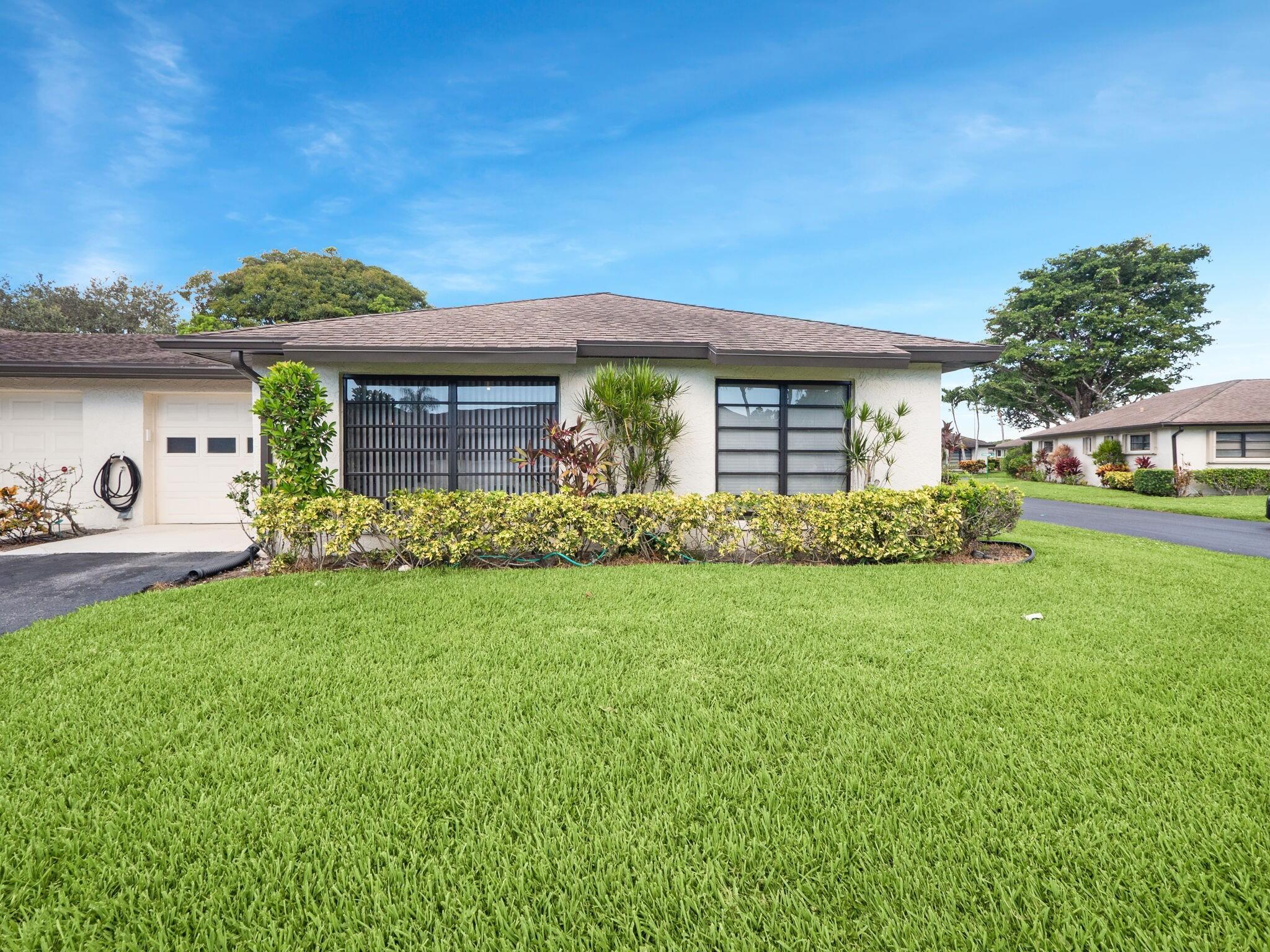 Welcome to Greentree Villas, a sought-after 55+ community in Boynton Beach. This beautifully updated 2-bedroom, 2-bath villa features a recently remodeled kitchen with sleek cabinetry and stainless steel appliances, along with updated bathrooms for modern comfort. The spacious living area is light and inviting, while the freshly painted interior and exterior and lush landscaping add to its curb appeal. Enjoy a low-maintenance lifestyle with community amenities including pools and clubhouses. Ideally located near shopping, dining, and just 15 minutes to the beach, this move-in ready home offers the perfect South Florida lifestyle.