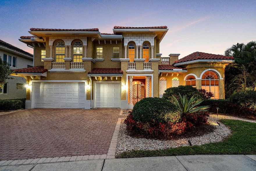 Rarely available and magnificent two-story home, with separate guest home, in the highly desired and gated community of Mediterranea. Boasting 5 bedrooms and 4.5 bathrooms, this home is the perfect blend of elegance and comfort. Courtyard model with heated pool and spa offering full privacy on a premium lot with direct lake views and private backyard. Courtyard offers ample space for entertaining, cabana bath, outdoor bar with built-in grill for comfort. Large, bright and spacious flow with high-volume ceilings. Kitchen has granite counters, newer high-end stainless-steel appliances, wine fridge and walk-in pantry. Custom Bass wood cabinetry throughout offers a sophisticated appeal. Spacious oversized master suite with two walk-in closets and a spa-like bathroom. New roof installed 2024 and three HVAC systems installed 2017, 2020 and 2020, pool pump 2025, new sprinkler system 2023, upgraded lighting to LED with all switches changed 2023, and gutters replaced 2024. Kitchen fridge about 3 years old, double-oven 8 years old, dishwasher 6 years old, and hot water tank installed 2022. Tile floors throughout first-floor and hardwood floors on the second-floor. Tinted hurricane impact windows and doors throughout. Decorative plantation shutters installed. Brick-paved driveway, courtyard and backyard patio. Iron courtyard gate with double glass-door entry to home. Large laundry room with utility sink and extra wine fridge. Extra-large driveway facing a 3-car garage with a full-size freezer and refrigerator inside. The exterior of the home was painted 2024. Home features a 300-gallon underground gas tank and 25kW whole-house generator about 8 years old, maintained biannually. Whole-house water filtration system installed with reverse osmosis under sink. Pool heater runs on gas. Home also features central vacuum system. Located in an A-rated school district and close to I-95, Turnpike highway, Boca Raton Town Center Mall, premier shopping, fine dining and places of worship. Community offers a guard-gated entry, tennis and pickleball courts, basketball court, sidewalks and exterior lighting throughout the neighborhood.