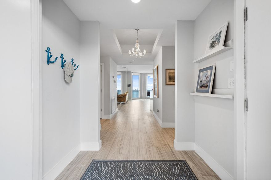 Welcome to this Penthouse Paradise! Step into this meticulously renovated 3-bedroom, 3-bath penthouse with breathtaking ocean views. Beautiful plank style ceramic tile flooring throughout. The custom kitchen offers gorgeous quartz countertops, custom cabinetry, premium SS appliances and much more. The living room is complimented with a built in custom wall unit with plenty of storage. Ocean views from the large primary bedroom, two walk in closets. Primary bathroom offers separate tub for relaxation! 2nd bedroom has en suite bathroom. 3rd bedroom/office includes a murphy bed. Enjoy a rare private garage, oceanfront pool, tennis court, grilling area, gym and clubroom. Building features a cooling tower, centralized hot water, high-speed internet, and cable-all included with HOA.