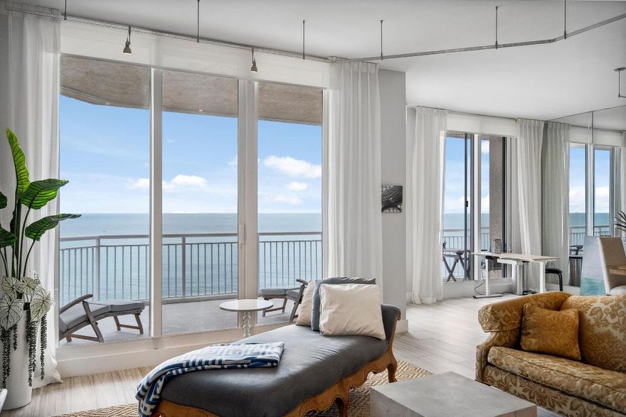 Welcome to an exceptional Penthouse Residence offering refined coastal luxury. This beautifully reimagined 3-bedroom, 3-bath 12th-floor Penthouse showcases sweeping ocean views and elegant finishes throughout. Sophisticated plank-style ceramic tile flooring creates a seamless, upscale feel. The custom kitchen features quartz countertops, bespoke cabinetry, and premium stainless-steel appliances. The living area is enhanced by a sleek built-in wall unit with ample storage. The spacious primary suite offers serene ocean views, two walk-in closets, and a spa-inspired bath with a jacuzzi tub. The second bedroom includes a private en suite bath, while the third bedroom or office features a convenient Murphy bed. Enjoy the rare private garage and resort-style amenities including an oceanfront pool, tennis court, grilling area, gym, and clubroom. Centralized hot water, high-speed internet, and cable are included in the HOA.