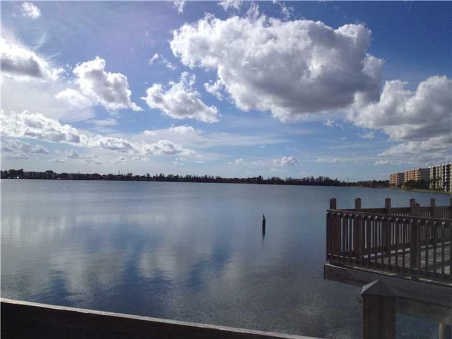 SPACIOUS FIRST FLOOR UNIT, LAKE VIEW. GRANITE COUNTER TOPS KITCHEN. SCREENED PATIO. STORM SHUTTERS FRONT AND REAR. TILE FLOORS THROUGHOUT. CONVENIENT TO 95, TURNPIKE AND BEACHES. AMENITIES INCLUDE: 3 POOLS, SAUNA, JACUZZI, GYM 24 AVAILABLE, LIBRARY, BASKE TBALL COURT, TENNIS COURTS. CLUBHOUSE WITH BAR AND WEEKEND FOOD SPECIALS. BOAT DOCK. PETS(2) OK 25 LBS AND UNDER. 24 HOUR GUARD GATE AND EVENING GUARD ROVER. RESORT STYLE LIVING.