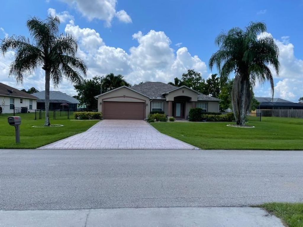 Photo of 5949 NW Hann Drive, Port Saint Lucie, FL 34986 (MLS # R10748274)