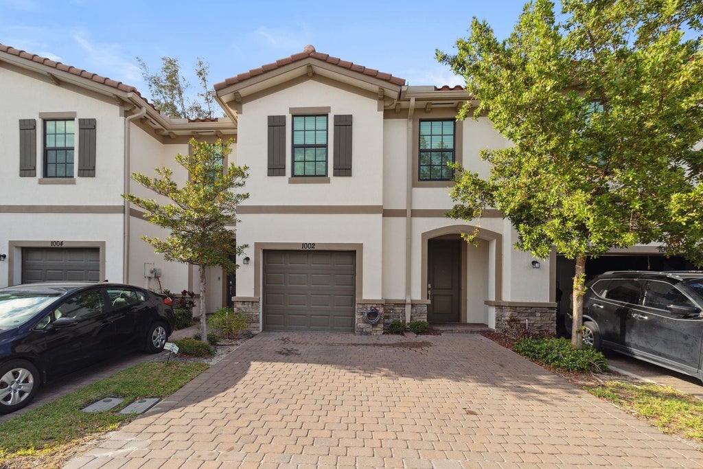 Photo of 1002 SWEET BRIAR Lane, Riviera Beach, FL 33410 (MLS # B26083476)