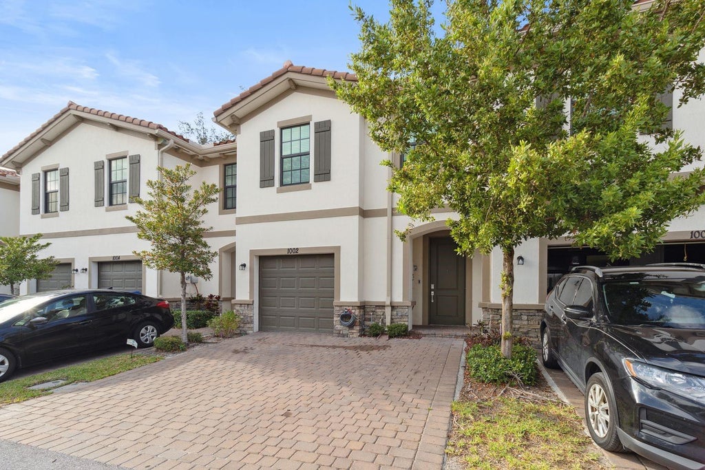 Photo of 1002 SWEET BRIAR Lane, Riviera Beach, FL 33410 (MLS # B26083476)