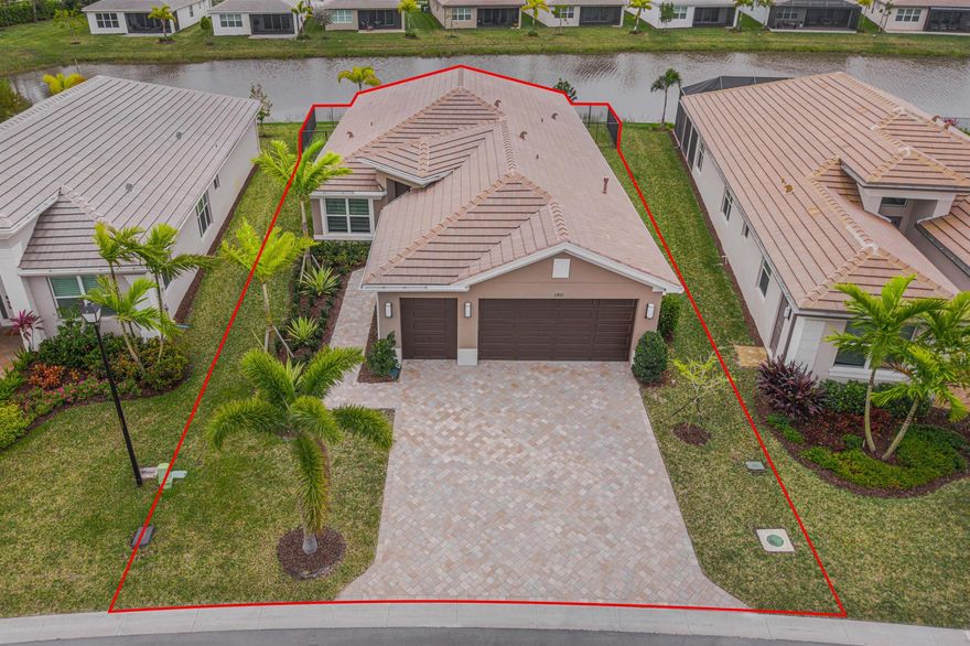 Resort style Living in Riverland ''Valencia Grove''  a 55 + gated community. Home has a beautiful Lake View (Premium Waterfront Lot) with your very own Inground Pool. Pool has been pre-wired for a Pool Heater.  This floor plan is called the ''Palazzo'' which has 3 bedrooms, 2.5 bathrooms and a Den. Tiled Floors throughout the Living Areas. The garage has been extended to accommodate larger vehicles (26' 5'' wide X 21' 7'' Length).  Kitchen has upgraded cabinetry, quartz countertops, and upgraded SS appliances. The outside porch is pre wired and plumbed for a Summer Kitchen. The Windows and Doors have custom blinds. All Windows and Doors are impact rated for Hurricane Protection.