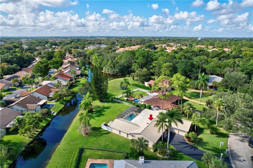 Who's hosting Christmas this year? YOU ARE!! *OVERSIZED 1/3 ACRE LOT (15,291)* This spacious 4/2.5 waterfront/pool home features: split AC system, partial impact windows, updated kitchen w/SS appliances, breakfast area, vaulted ceilings w/recessed lights, formal dining & living room, family room, fireplace, tile & laminate floors, Master suite boasts walk-in built out closet, dual cabana baths w/dual sinks in both, vanity & step-in shower. Your backyard oasis is surrounded by lots of green space w/covered patio & screened-in pool,(wet bar & refrigerator), perfect for entertaining year around. Alarm system, ring doorbell w/motion lights & smart garage door opener. Irrigation system fed from canal. Best of all No HOA! Close to shopping, dining, schools, parks & Sawgrass **OVERSIZED 1/3 ACRE LOT (15,291 sq ft)** This spacious 4/2.5 waterfront/pool home features: 2014 split A/C system, 2021 water heater, partial impact windows, updated kitchen w/SS appliances & Silestone counters, breakfast area, vaulted ceilings w/recessed lights, formal dining & living room, family room, fireplace, tile & laminate floors, Cabana bath w/dual sinks and Master suite boasts walk-in closet, cabana bath w/dual sinks, vanity & step-in shower. Your backyard oasis is surrounded by lots of green space w/covered patio & screened-in pool, (wet bar & refrigerator included), perfect for entertaining year around. Included: Alarm system, ring doorbell w/motion lights & smart garage door opener. Irrigation system fed from canal. Best of all No HOA! Close to shopping, dining, schools, parks & Sawgrass