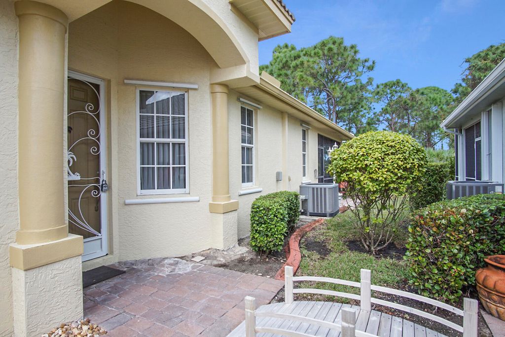 Photo of 861 NW Red Pine Way, Jensen Beach, FL 34957 (MLS # R10945314)