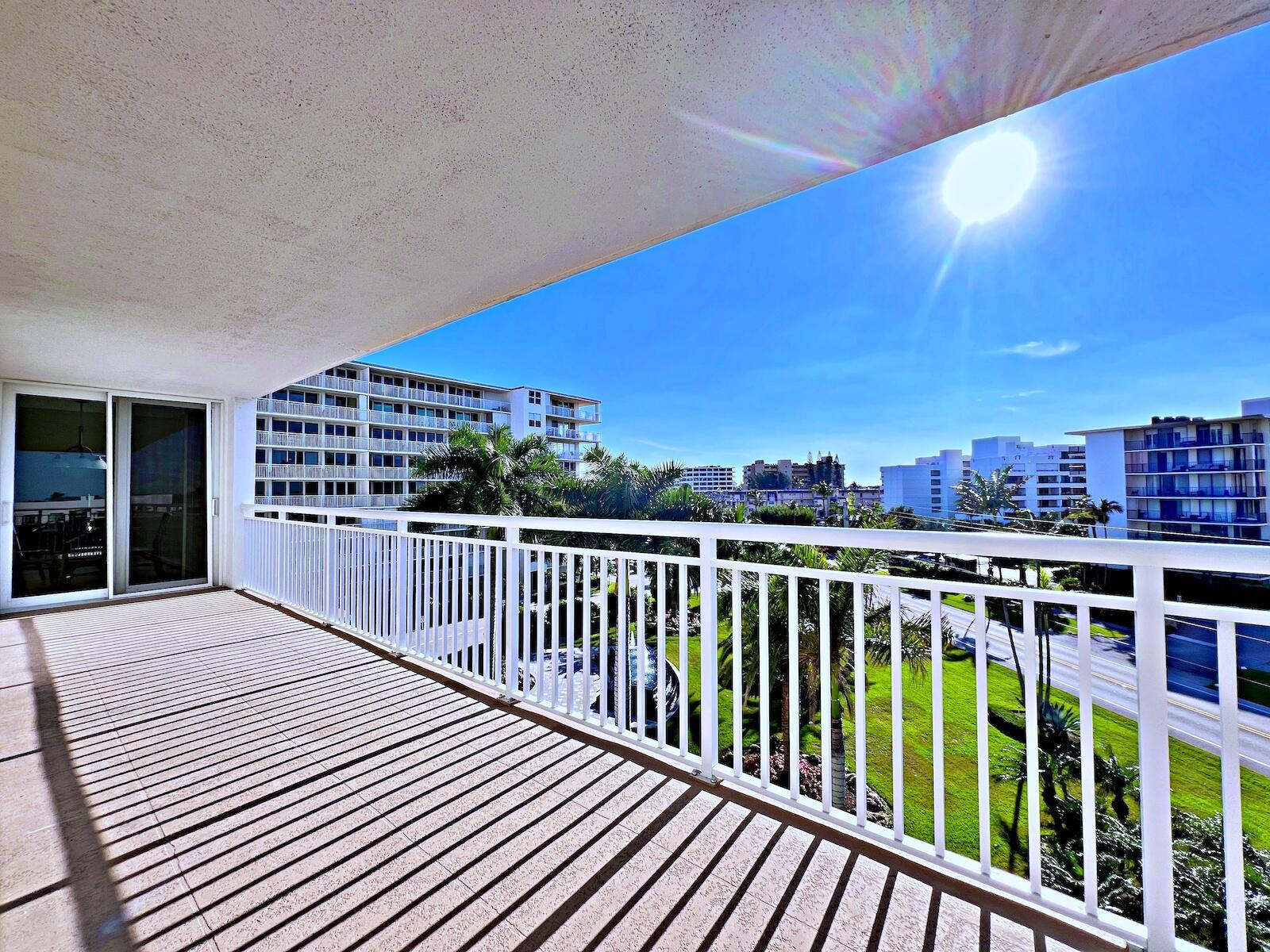 Welcome to this beautifully updated 2-bedroom, 2-bathroom, very spacious 1,650 sqft corner unit in The Barclay, where elegance meets coastal comfort. This bright home features an open layout with tile flooring throughout and seamless access to a generous wrap-around patio through impact-resistant doors, the perfect spot to enjoy the mesmerizing sunsets! The modern kitchen offers granite countertops, stainless steel appliances, and a sunlit breakfast room with direct balcony access. The primary suite boasts two walk-in closets and a spa-like bathroom with double sinks, a jacuzzi tub, and a glass-enclosed shower. The second bedroom features built-in storage, French doors, and a stylishly renovated bathroom.