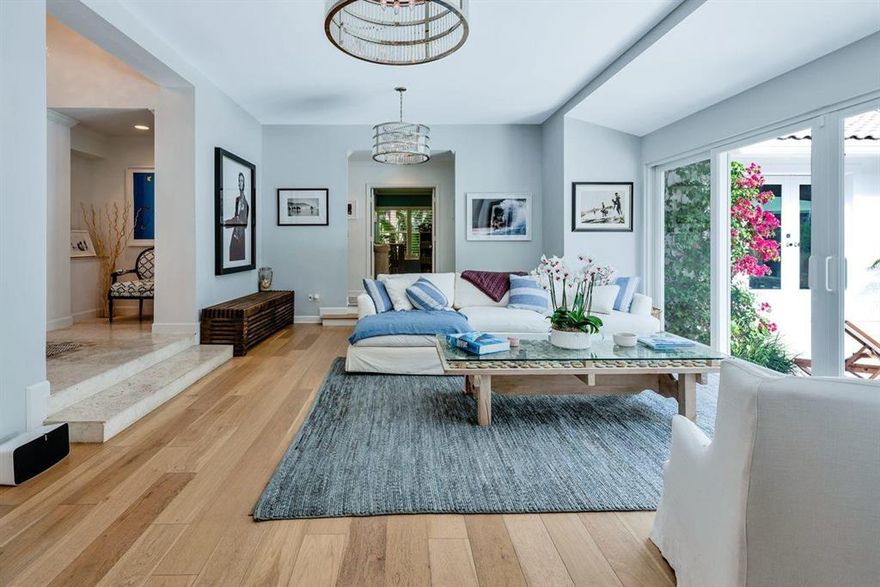 Beach Chic Oasis in the North End! • Unbelievable Quality Renovation • Light + Airy 4 bedroom, 3 bath • Marble + Hardwood Floors Throughout • Impact Glass Throughout • Lush Landscaping • Heated Saltwater Pool • In-Home Gym • Beach Access • Convenient Lake Trail Access