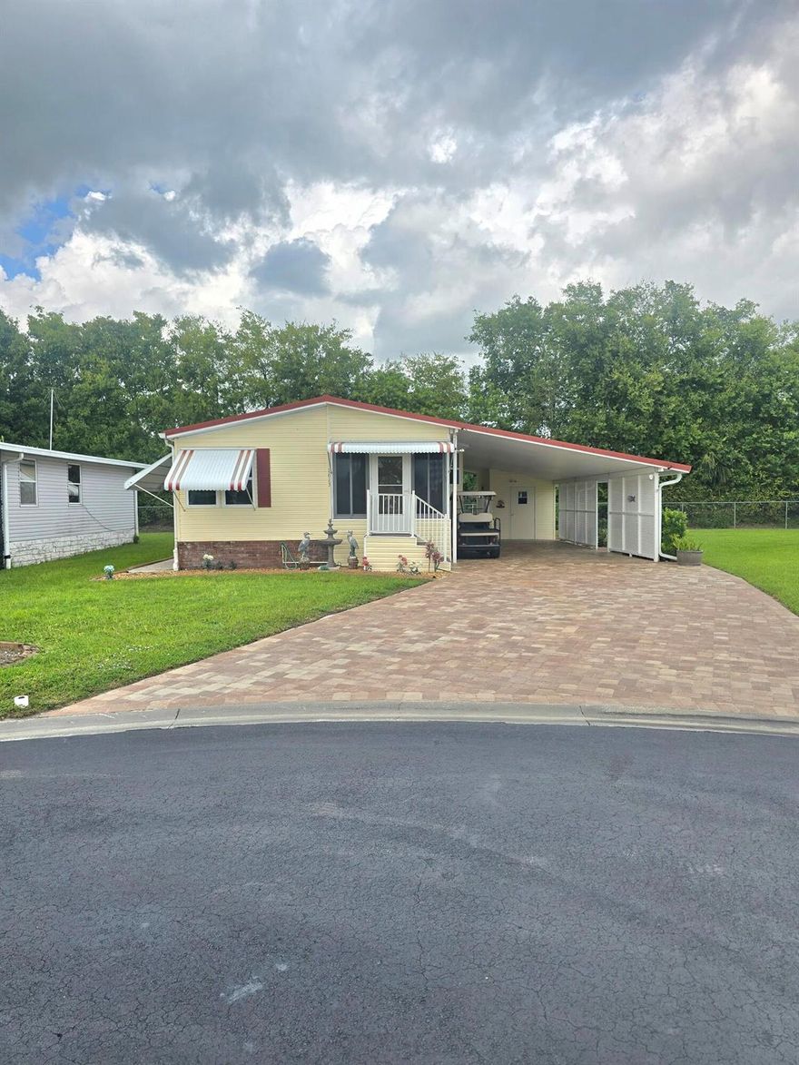 Stunning Gem in Seminole Cove 55+ Community!Offers comfort, style and peace of mind with thoughtful upgrades throughout. Featuring an open concept layout. You will enjoy vaulted ceilings with ceiling fans, abundant light, and a spacious formal dining room perfect for entertaining. 2Bed-2Bath, Furnished & turnkey, Metal roof for long-lasting durability. New thermo windows for energy efficiency, New flooring-re carpeted bedrooms, kitchen completely redone  with soft close cabinets and SS appliances. AC 3 yrs old & Hot water heater 5yrs old, Generator 2 yrs old. includes: extra refrigerator, freezer, air compressor, & golf cart. Tie downs just replaced, irrigation system recently redone. Beautifully paved all around the home. Public water & sewer. Community has a heated pool, clubhouse&more.