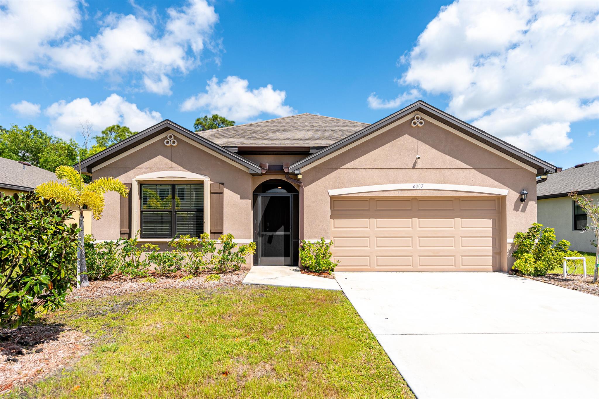 WOW. GREAT VALUE. UPGRADES include a massive screened porch, accordion shutters and premium flooring in the Master Suite and Guest bedroom...MOVE-IN-READY 4-bedroom, 2-bathroom home in the peaceful and gated St. Andrews Preserve community. Built in 2022, this home boasts an open, split floor plan with a spacious kitchen featuring granite countertops & stainless steel appliances. The stylish 18'' ceramic tile flooring flows seamlessly throughout the living areas. Enjoy privacy as screened porch, overlooks preserve area.. Enjoy access to a clubhouse, pool,& fitness center, included in the affordable HOA fee. Conveniently located near highly-rated schools, beaches, I-95