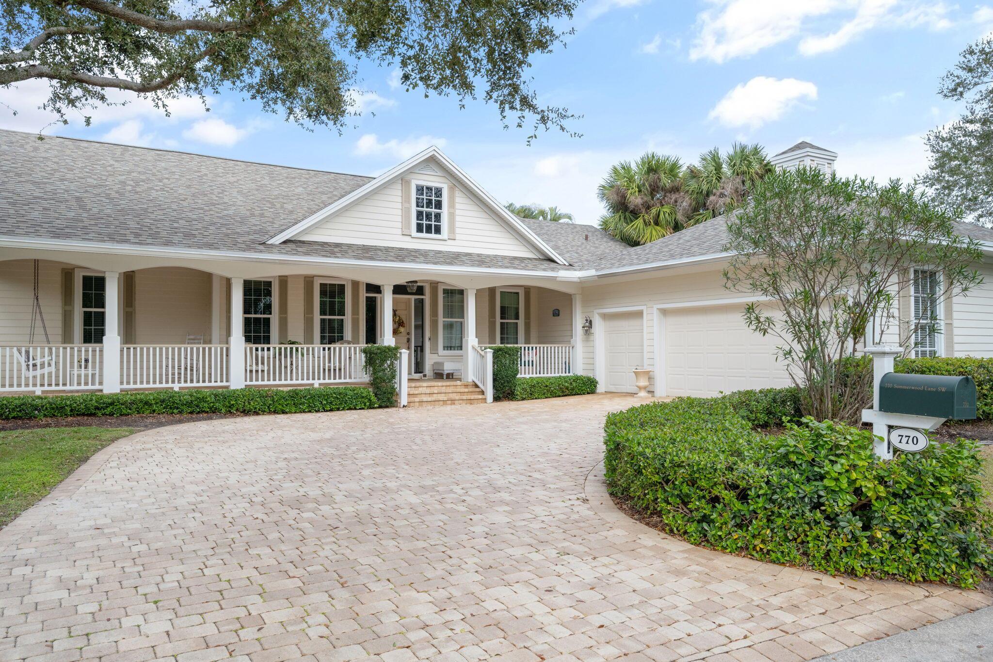NEW ROOF 2024. Fantastic views of the golf course. Large, screened lanai with heated pool & multiple sitting areas. Family room w/ bamboo flooring + an office. Cypress ceilings on lanai and front porch. Granite counters, breakfast bar, Jenn-Air appliances w/ induction cooktop. 2 car garage + golf cart. Social Membership Required.