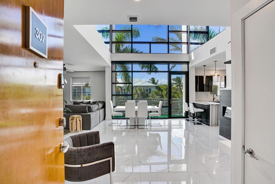 Experience the best of coastal living in this bright and modern 2-bed, 2-bath residence at Meridian Delray, just steps from Atlantic Ave's restaurants, boutiques, and world-class beaches. This two-story condo offers soaring ceilings, floor-to-ceiling windows, and an open living space filled with natural light. Upstairs, both bedrooms offer privacy and comfort, while the sleek kitchen and contemporary finishes enhance the home's modern aesthetic. Enjoy the private rooftop pool and lounge area--perfect for entertaining or unwinding. A rare opportunity to live in one of Delray's most desirable locations, blending style, luxury, and walkability.