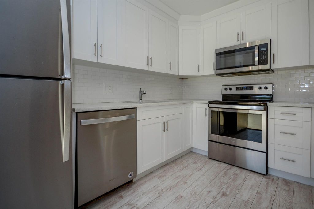 Photo of 3157 Gardens East Drive #A, Palm Beach Gardens, FL 33410 (MLS # R11084103)