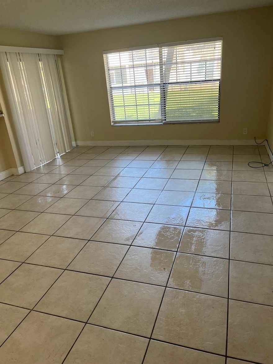 This great ground floor apartment is located in the desirable excellent LOCATION, the WOOD HUE Complex, Conveniently just minutes away from Publix, restaurants ,entertainment and all essential services. This bright unit is ready to move in, . Desirable ground floor unit in a well maintained quiet community. 
 AS IS Community pool, clubhouse, BBQ area, and more! 1 assigned parking space plus guest spots as well
Laudnry in the unit.
TENANT OCCUPIED PAYING $1600 GREAT TENANT