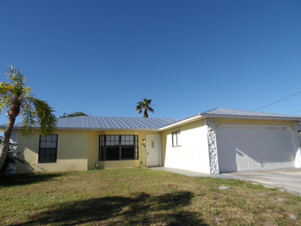 Photo of 698 SW Jeanne Avenue, Port Saint Lucie, FL 34953 (MLS # R11070556)