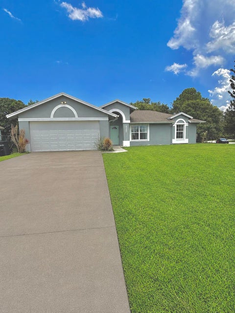 Photo of 2397 SW Lejune Street, Port Saint Lucie, FL 34953 (MLS # B26046126)