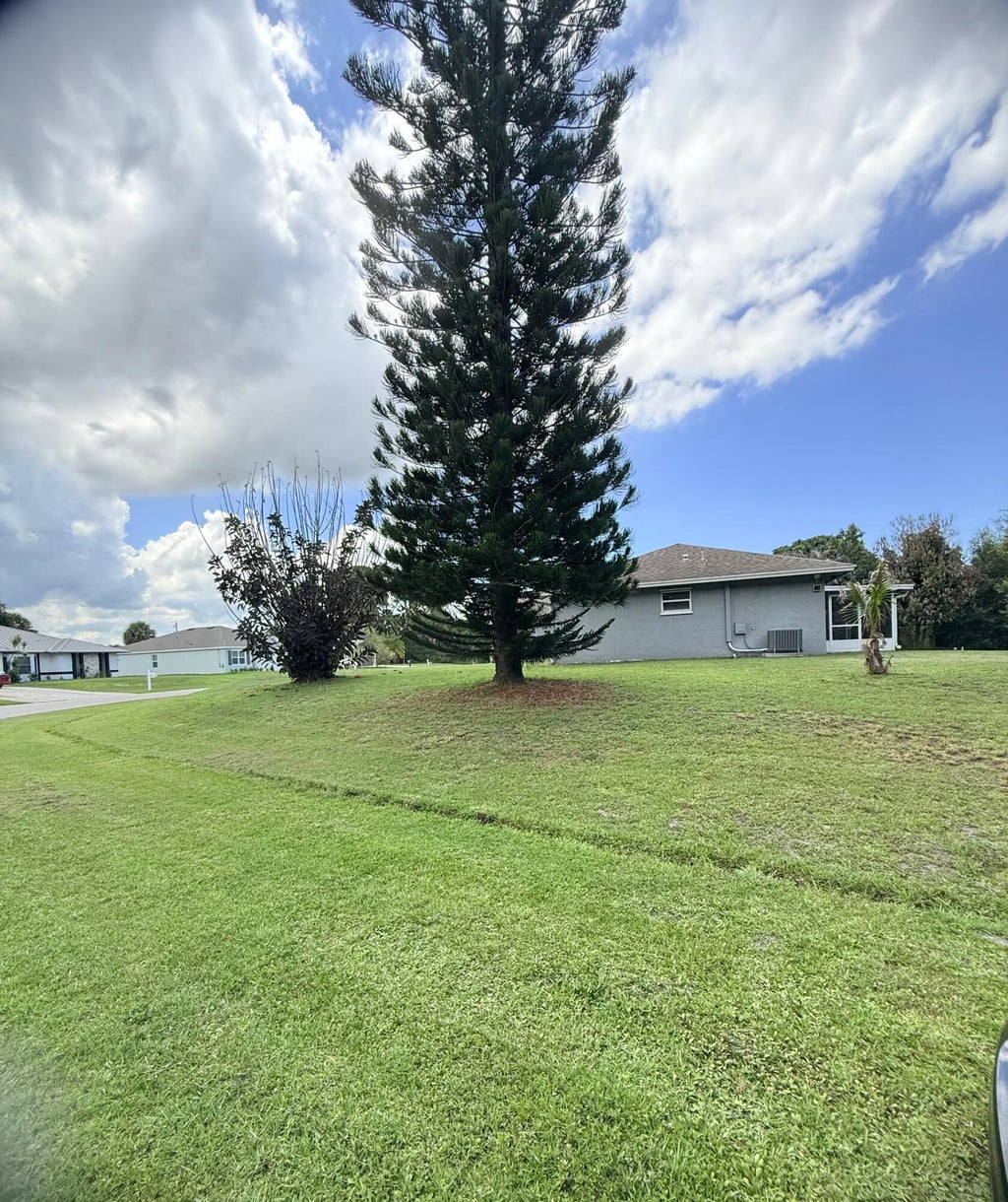 Photo of 2397 SW Lejune Street, Port Saint Lucie, FL 34953 (MLS # B26046126)
