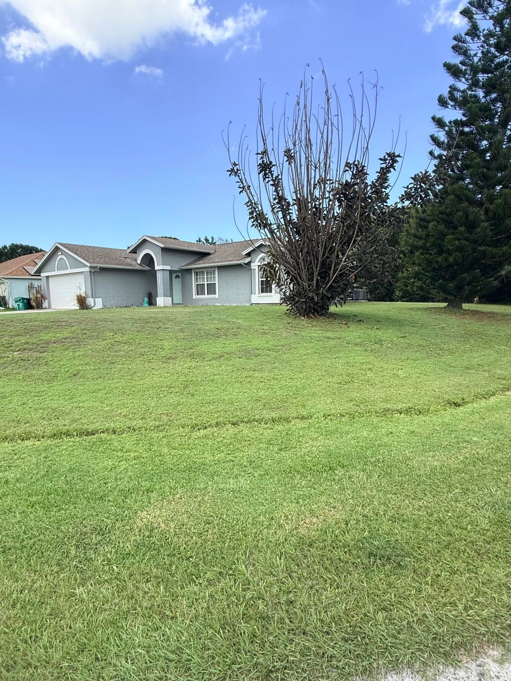Photo of 2397 SW Lejune Street, Port Saint Lucie, FL 34953 (MLS # B26046126)