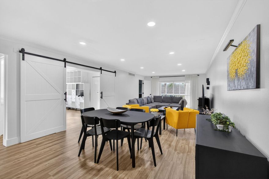 Elegant Beachside Living-Beautifully updated 3bed2bath is ideally positioned just moments from the beach. Its been completely renovated, with wide-plank flooring, smooth ceilings, custom lighting and a sunlit layout. The sleek galley-style kitchen features granite countertops, a barn-style sink, custom cabinetry, and premium stainless steel appliances. Both bathrooms have been completely redone. The 3rd bedroom is a home office with an oversized barn door that invites natural light and enhances the open, airy feel of the interior. As a corner unit, you'll enjoy added privacy. Sugar Sands offers amenities: Olympic-size pool, tennis courts, pickleball courts a clubhouse, marina, and beach access, along with billiards, card rooms, shuffleboard, saunas, and pavilions with outdoor grills.