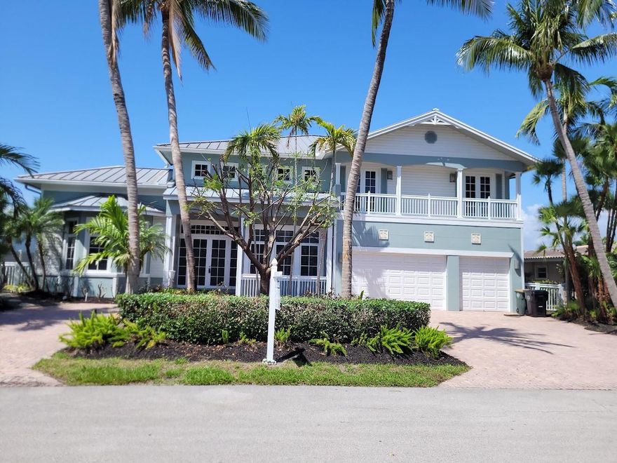 "VENETIAN ISLES", BOATERS PARADISE! 2 STORY CANAL FRONT HOME W 5 DEROOM/3.5 BATH POOL IN THE EXCLUSIVE WATERFRONT GRAND CANAL AREA OF LIGHTHOUSE POINT, FL. CUSTOM BUILT IN 2002- A 2 STORY KEY WEST STYLE HOME, CBS BLOCK/FRAME W/ METAL ROOF, 3 CAR GARAGE, 85 FT DOCK/DECK WITH A 16,000 LBS BOAT LIFT, GRAND MASTER SUITE/SPA ON FIRST FLOOR W 4 BEDRM UPSTAIRS W/DEN/OFFICE AREA, CUSTOM ETCHED GLASS DOOR ENTRY TO FOYER LEADING TO SPACIOUS LIVING/DINING/KITCHEN AREAS, 2ND FLOOR LARGE BALCONY FOR SUNSETS, BEDROOM BALCONIES, FRESHLY PAINTED INSIDE AND OUT, CIRCULAR PAVER DRIVEWAY, MATURE LANDSCAPING FOR PRIVACY.