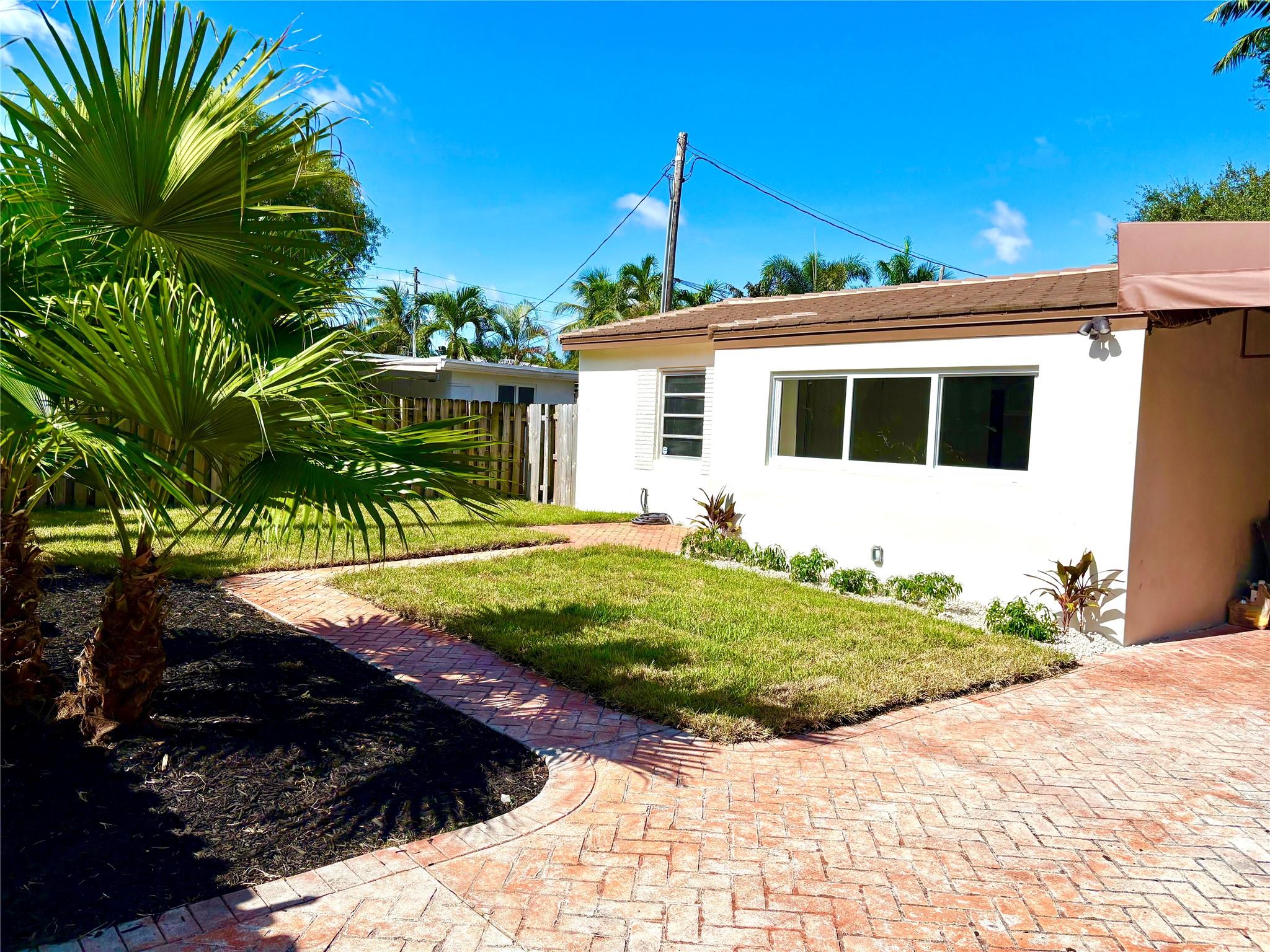 SERENE, PRIVATE AND COMPLETLY FENCED IN HOME IN TARPON RIVER! THIS 2 BEDROOM 1 BATH HOME FEATURES NEW 36X36 TILE FLOORS, FRESH PAINT, NEW WASHER AND DRYER AND PLENTY OF NATURAL LIGHT. THE OVER SIZED SCREENED IN PATIO AND LARGE YARD ARE A PERFECT SPACE FOR OUTDOOR LIVING, BBQS AND ENTERTAINING. CONVIENTLY LOCATED TO FT LAUDERDALE BEACH, DOWNTOWN, LAS OLAS, PARKS, THE AIRPORT, PORT EVERGLADES, 95, 595 AND THE TURNPIKE. GREAT RESTAURANTS, BARS, GROCERY AND SHOPPING WITHIN MINUTES. COME AND MAKE YOURSELF AT HOME IN THIS SOUGHT AFTER, EAST FT LAUDERDALE NEIGHBORHOOD. LAWN MAINTENANCE INCLUDED.