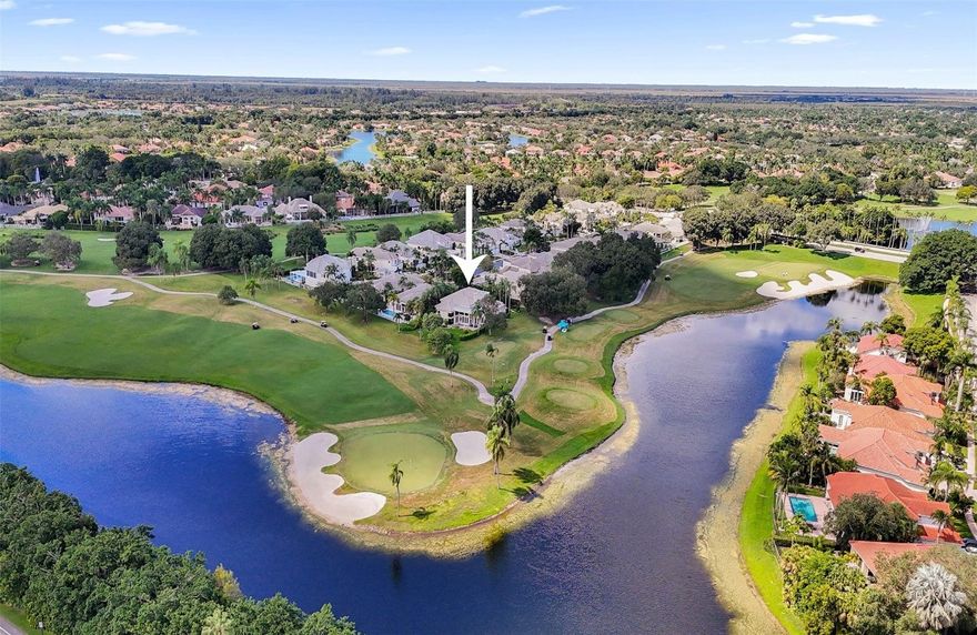 Nestled on one of the most coveted PANORAMIC PREMIUM GOLF & LAKE lots in all of Weston Hills, this magnificent home sits on a cul-de-sac in the exclusive boutique enclave of The Fairways. A long paver driveway, flanked by high privacy hedges, leads to 3600SF of timeless elegance with soaring 20-foot ceilings & breathtaking wraparound views of the TOUR COURSE through floor-to-ceiling glass walls that seamlessly connect the grand interior to the stunning surroundings. Primary & custom den downstairs; upstairs, 2BD w/bath. Exquisite chandeliers, custom mirrors, solid hardwood flooring, plantation shutters, double-sided fireplace. NEW UPDATES incl BRAND NEW IMPACT sliding glass doors & plank floors (Fall 2025), 2024 tankless WH, 2024 flat roofs, 3 NEW AC units, plumbing, $25K landscape & more! The thoughtfully designed 4Bed (including custom built-in office), 3 Bath, 2CG was designed to bring the outdoors in, where walls of glass seamlessly connect the interior to the stunning surroundings. Downstairs, the spacious primary suite features new luxury plank flooring, custom closets, a double-sided marble fireplace and sitting room that overlooks the fairways, as well as a spa-like marble primary bathroom ensuite. The 4th Bedroom, also downstairs, is outfitted as a beautiful home office, with custom solid wood cabinetry and shelving, and a large walk-in closet, with adjacent bathroom. On the upper level are two huge bedrooms, both adjoined by a spacious bathroom.Significant investments between 2023-2025 include brand new impact glass doors (living, family, primary) in Fall 2025, new luxury plank flooring (2025), freshly painted bedrooms, bathrooms and all baseboards, a 2024 tankless water heater, extensive plumbing updates and three newly installed flat roofs (2024). The home is climate-controlled by three newer A/C units: a 2.5-ton unit (2021) for upstairs, a 2-ton unit (2022) for the primary suite, and a powerful 5-ton unit (2024) for the living areas. Additional updates include new laundry room sink, new garage door opener and springs (2025), new sensors (2023), a newer side door from the garage, updated sprinkler system and gutters for the entire home, and $25,000 in professional landscaping. This property represents the ultimate in luxury, comfort, and peace of mind, all set against the backdrop of unmatched golf and lake views. With optional country club membership at The Club at Weston Hills, walkable distance to the trendy Weston Town Center and top-rated schools nearby, the best of South Florida living awaits you, welcome home!