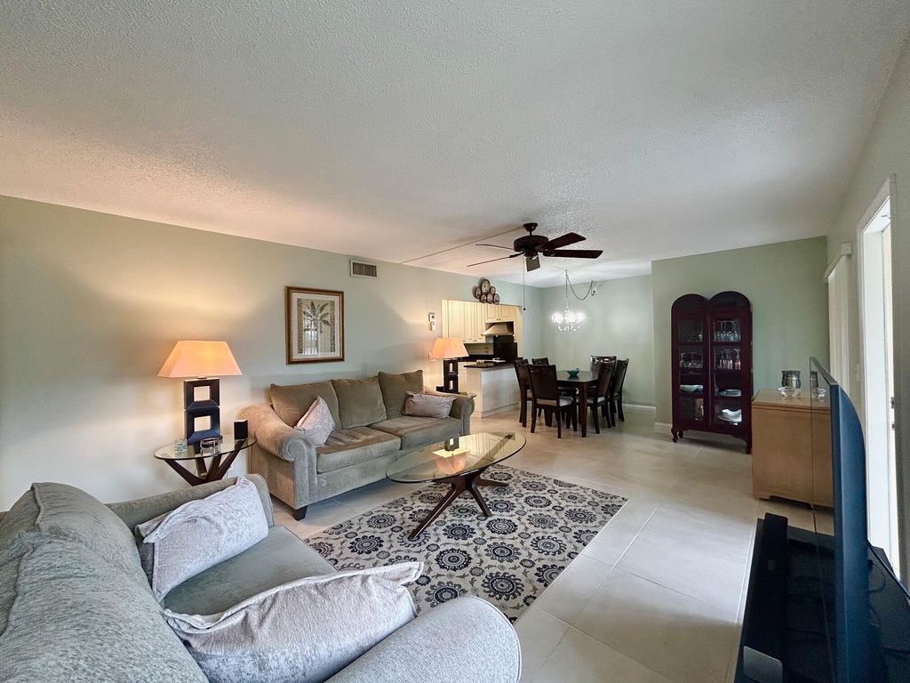 Photo of 140 Lake Pine Circle #A-1, Greenacres, FL 33463 (MLS # B26014089)