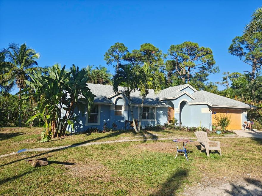 Lovely 3 bedroom 2 bath house with 2 car garage on a 1.26 Acre of land. House is will mentained. New Roof in 2022. New water heater in 2021. New AC in 2020. The coverered and screen patio provide more space to relax.  There is a Slab for a RV that has electricity available but no sewer. Location is Private and centrally located. Lots of Fruit Trees and lots more to see. Call for an appointment today.