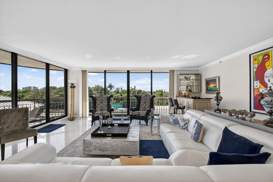 Enjoy this beautiful open floor plan with ceiling to floor Impact Glass Windows throughout. Balconies off of every room to enjoy the sunsets and sunrises.  An open kitchen with snack bar, eat in kitchen nook plus a large formal dining space, this feels like a home. Two large bedrooms with 3 full baths and 1 half bath plus private laundry. The master bedroom is private and spacious, with 2 separate bathrooms and 2 walk in closets. The exceptional amenities include two heated swimming pools with all new decking, elevated hot tub, two fully equipped fitness centers, sauna, two tennis courts, bocce court, residential barbecues, luxurious owners' lounge, billiard room, full library and private resident poolside restaurant. The Martinique II offers a totally carefree lifestyle with private beach access, twenty-four-hour concierge services in each tower a manned guard gate entry with twenty-four-hour security plus garage parking.