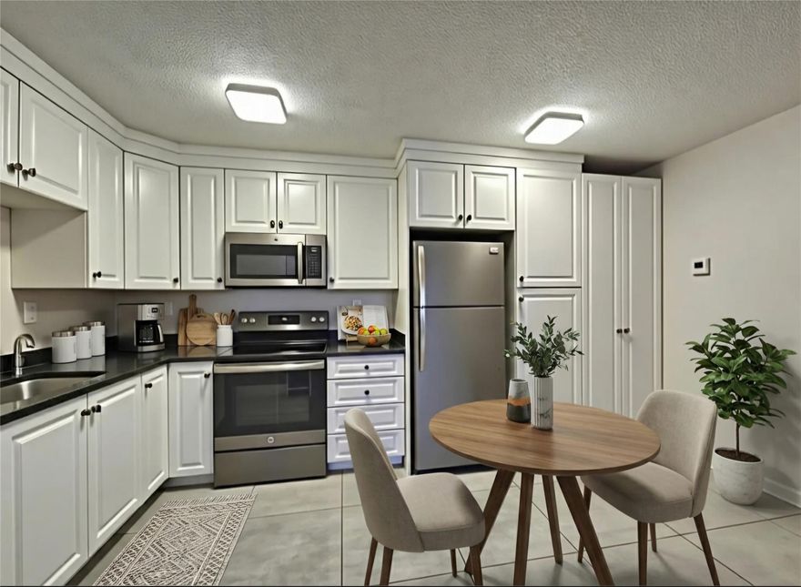 This significantly renovated corner unit offers a perfect blend of style and convenience. Enjoy the luxury of custom cabinetry, granite countertops, and elegant porcelain tiles throughout. The open balcony provides a serene lagoon view, ideal for relaxation. Nestled on the first floor of a pet-friendly community, this home offers abundant green space for you and your furry friend to frolic. The bathroom features stunning gray tile from tub to ceiling and an ergonomic white tub for ultimate relaxation. A cleverly concealed stackable washer and dryer lie behind beveled French doors for effortless laundry days. The sunlit bedroom boasts a lagoon view and a spacious walk-in closet. Experience the perfect blend of comfort and elegance in this exceptional home!