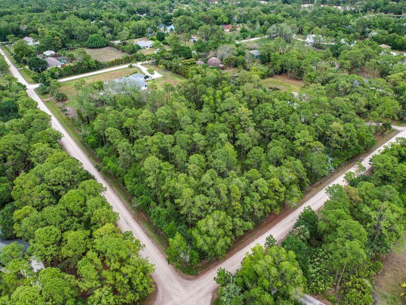 Your Opportunity! Beautiful high and dry 2.5 acre parcel available for sale in Jupiter Farms. Corner lot with tall trees and total flexibility. Just off 110th where other multi million dollar estates are currently under construction. Quick and easy access to Indiantown Road, Publix plaza, restaurants and all the East side amenities. Best of all, NO HOA!