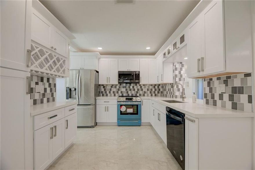 Amazing corner lot 3bed/3bath home in desirable community of Woodlands that you will definitely call it home! It features BRAND NEW ROOF 2021 & IMPACT DOORS & WINDOWS. The interior layout offers formal dining, living & family rooms, new knockdown texture ceiling, stunning kitchen with wood cabinetry and quartz countertop, 32x32 tile floors throughout living area and laminate floor in all bedrooms, beautiful lighting, brand new range oven with microwave, laundry-utility room, 108 SQFT screened in patio & 304 SQFT garden atrium. Low HOA fee includes lawn service, 24-hr security, section clubhouse & heated pool.