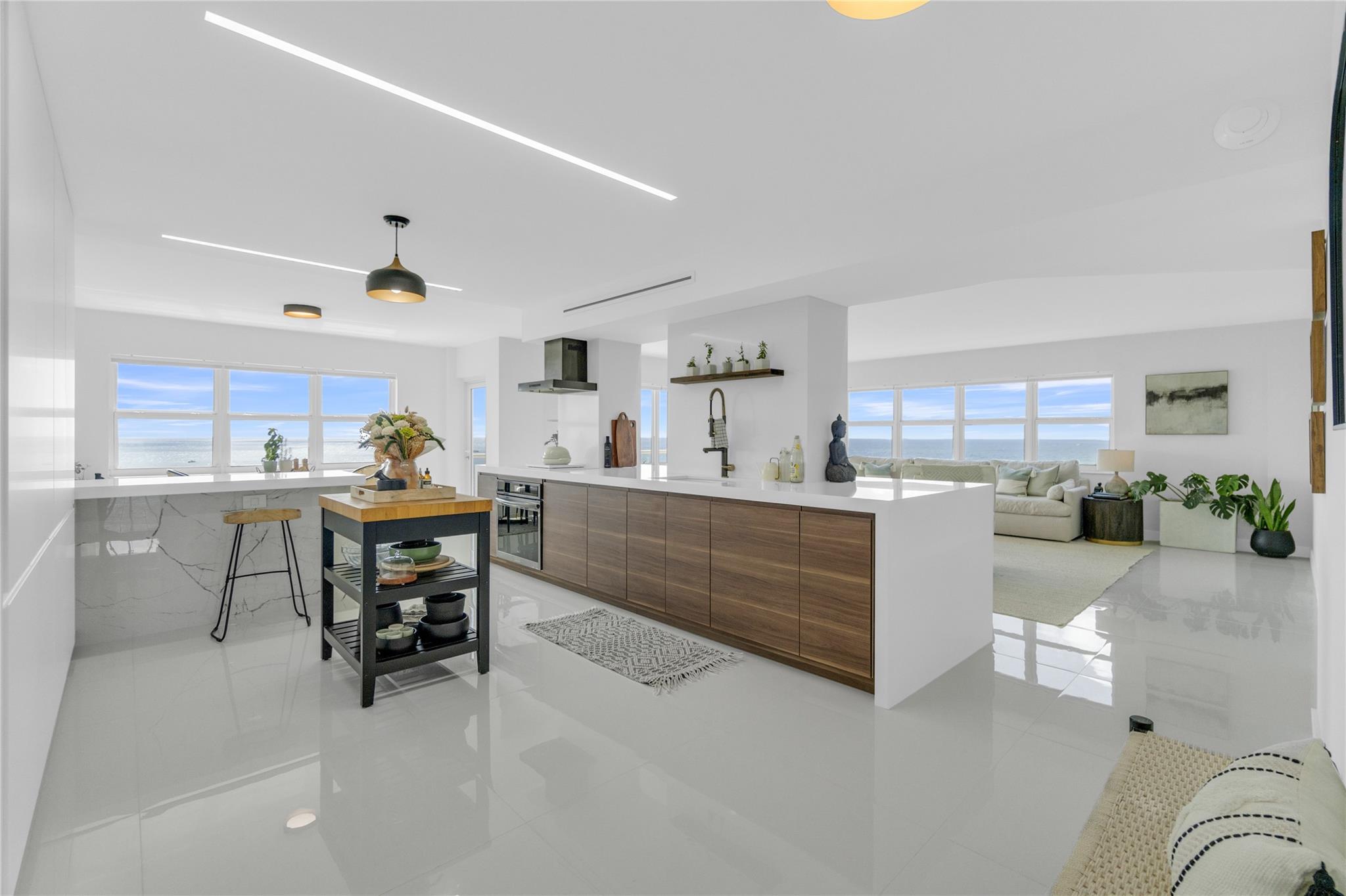 Stunning ocean, intracoastal, pier, & city views with sunrises & sunsets from this 1900 sq ft corner unit, 3 bds, 2 ba with private catwalk entrance. Steps to the beach, restaurants, water sports, Pompano Pier & City events - fireworks, drone shows, yoga & more. Upgrades include renovated kitchen open to living room, tile flooring, water heater, AC, appliances, impact windows & doors, bathrooms, water filter system, electric shades, built-in closets, walk-in primary closet, & washer/dryer. Assigned garage parking spot & storage unit. Amenities - heated pool, fitness room, party room, car wash area, EV charging, 24 hr security, pet-friendly & more. Many building updates are in progress. Next to the upcoming high-end 'W' property. Owner Agent. No waiting, move in & enjoy coastal living now!