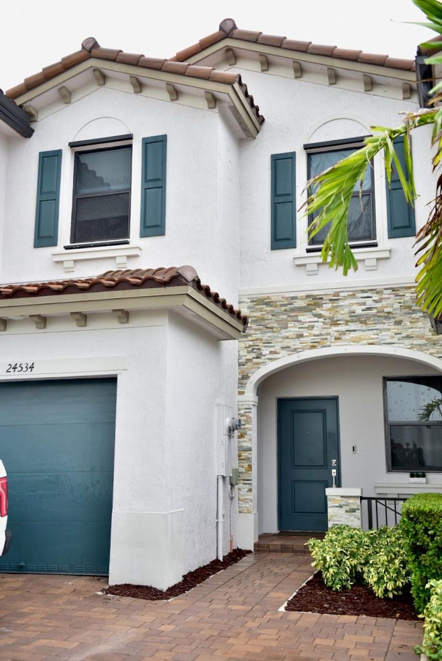 Welcome to your new home at 24534 SW 119th Place in the vibrant community of Homestead, FL. This modern 3-bedroom, 2.5-bathroom townhome, built in 2022, spans 1,442 square feet of stylish living space. Enjoy the open layout with easy flow from the living room to the kitchen, Paved back yard perfect for gatherings. The fenced backyard provides privacy, while being pet-friendly is a bonus for animal lovers. Just minutes from the Florida Keys, with excellent access to roads, hospitals, and natural sites, this townhome offers a seamless blend of modern living and convenience.