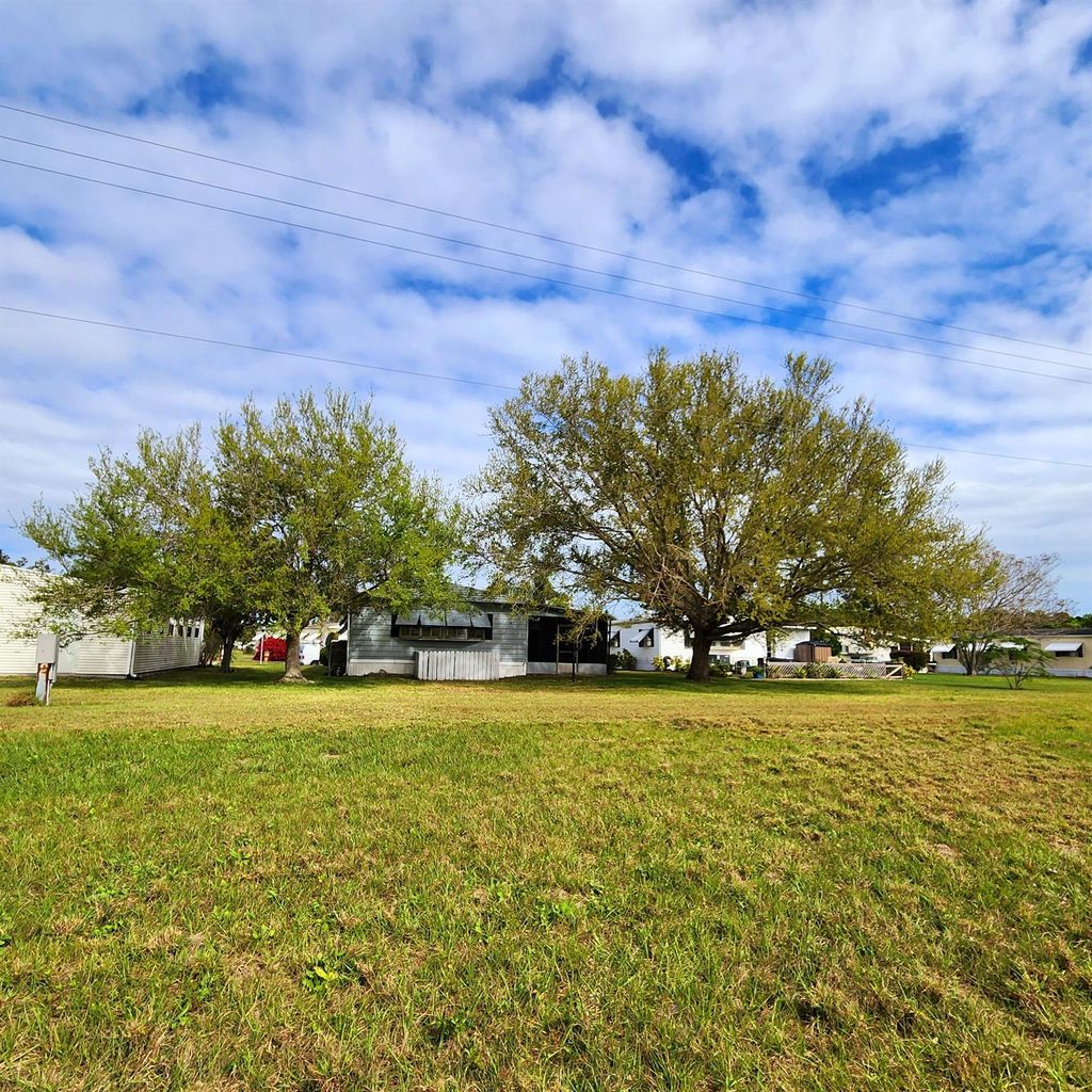 Photo of 105 E Carribbean, Port Saint Lucie, FL 34952 (MLS # R11066988)