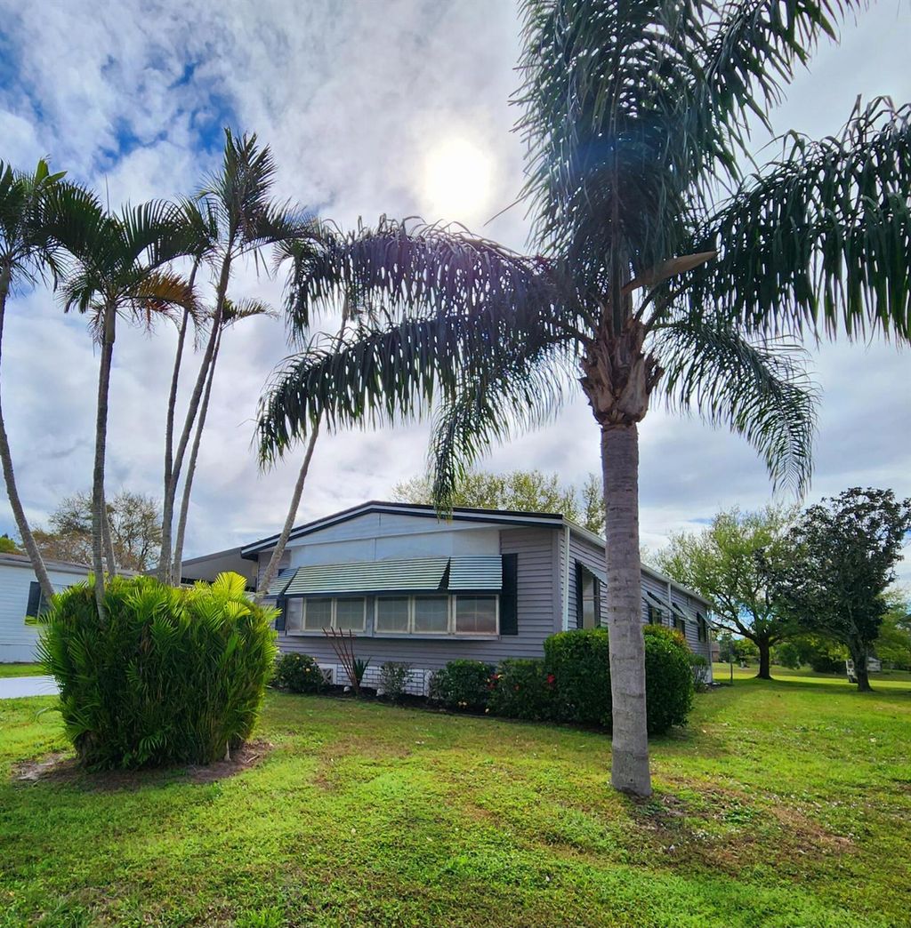 Photo of 105 E Carribbean, Port Saint Lucie, FL 34952 (MLS # R11066988)