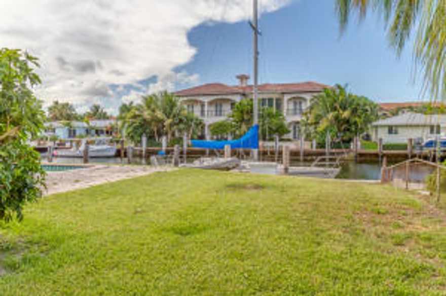 THE PERFECT SPOT FOR YOUR FLORIDA DREAM HOME!! Located on the closest canal to the ocean via the Hillsborough Inlet, in the beautiful community of Lighthouse Point on the Palm Beach coast between Ft Lauderdale and W Palm Beach. This jewel of a city is charming, peaceful, and very secure (has its own 43-man police dept and electronic surveillance system). The lot has a 100' waterfront and is 110' long with an 80ft dock on the Beacon canal. This canal is 100 ft wide with 9-10 depth at low tide according to local documentation. Residents of Lighthouse Point enjoy strolling on their side walks, enjoying the parks and beach, pools and tennis courts. Located w/in 2 miles of the Executive Airport, Pompano Beach Golf Course, Yacht Club, Country Club and Marina. THIS IS FLORIDA LIVING AT ITS BEST.