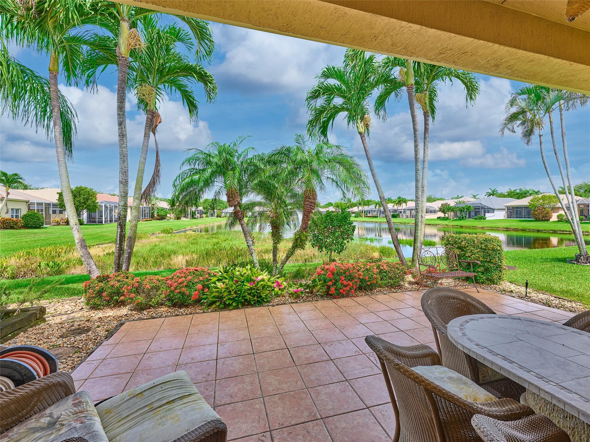 Welcome to Mizner Falls in Boynton Beach. This long lake waterfront view home, with a NEW ROOF (Dec 2024),
offers 3 bedroom and 2 1/2 baths, plus a hobby/workout room. (3rd bedroom being used as an office). This home was built for entertaining with its open floor-plan, and glass doors to the open patio. It has majestic Sunset views. The remodeled kitchen offers quartz countertops and stainless steel appliances. The master bathroom was remodeled last year. A/C and W/H were replaced in 2021. Gas Water Heater and Dryer. Gas line for Barbecue on patio too. Hurricane accordion shutters. This over 55 community offers activities and clubs throughout the year. The location of the community makes it easy for shopping, restaurants, highways and the PBI Airport. The Beach is only minutes away.