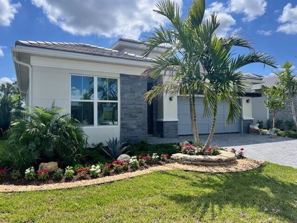 Photo of 10226 Timber Creek Way, Palm Beach Gardens, FL 33412 (MLS # B26024967)