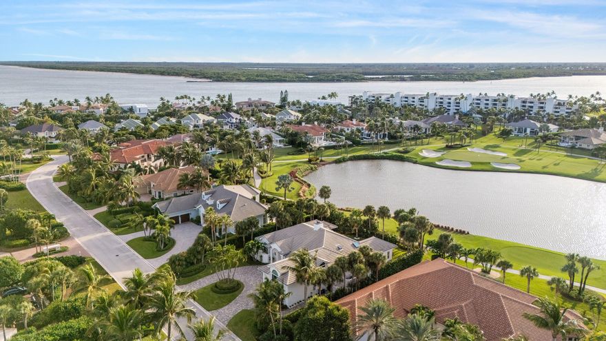 Set on one of the most coveted golf course lots in Sailfish Point, this refined two story residence offers sweeping lake and fairway views just steps from private beach access. The interior blends warmth and sophistication with defined living and dining spaces, a double sided fireplace, a chef's island kitchen and glass doors that open fully to the pool, spa and summer kitchen. Recent improvements include a complete landscape overhaul, added shiplap and custom wood detailing, selective interior renovations and a refreshed primary suite. Additional features include a 2016 roof, impact windows and doors and an EV charging station. Sailfish Point spans 532 acres at the southern tip of Hutchinson Island and is considered one of South Florida's premier ocean to inlet private communities.