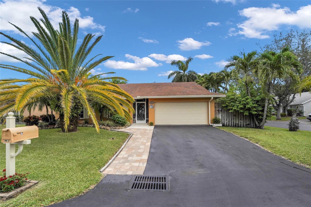 Photo of 9811 NW 53rd Court, Coral Springs, FL 33076 (MLS # B26064113)