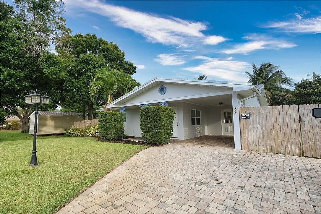 A beautifully updated 2 bedroom, 2 bathroom home perfectly located in the heart of Vero Beach. Enjoy the convenience of being within walking distance to grocery stores, restaurants, and shopping, and just minutes from the beach! This home features durable and stylish terrazzo floors throughout, an upgraded kitchen with modern finishes, and a full-size washer and dryer for your convenience. The fully fenced backyard offers privacy and space for outdoor enjoyment, while the 1-car carport provides covered parking. 1st and Double Security to move in.